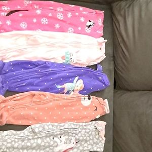 Baby girls footed sleepers.